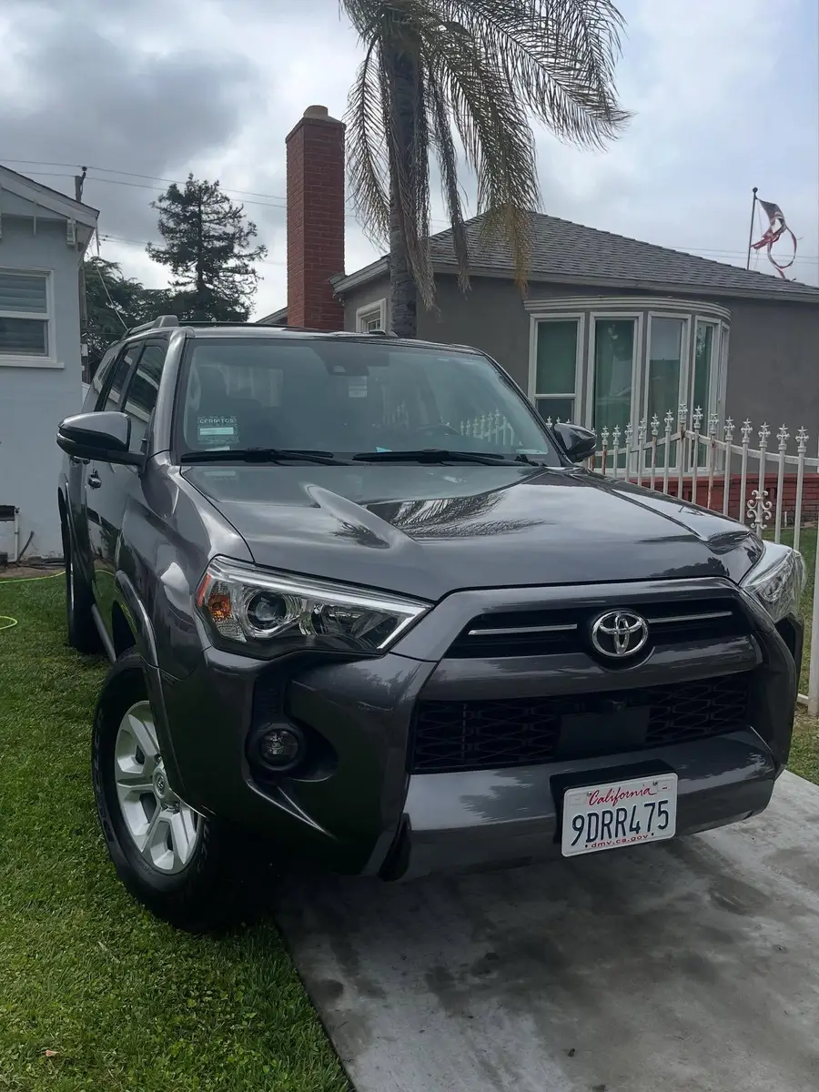 Grey Toyota 4Runner after detailing, parked at the curb in front of a house