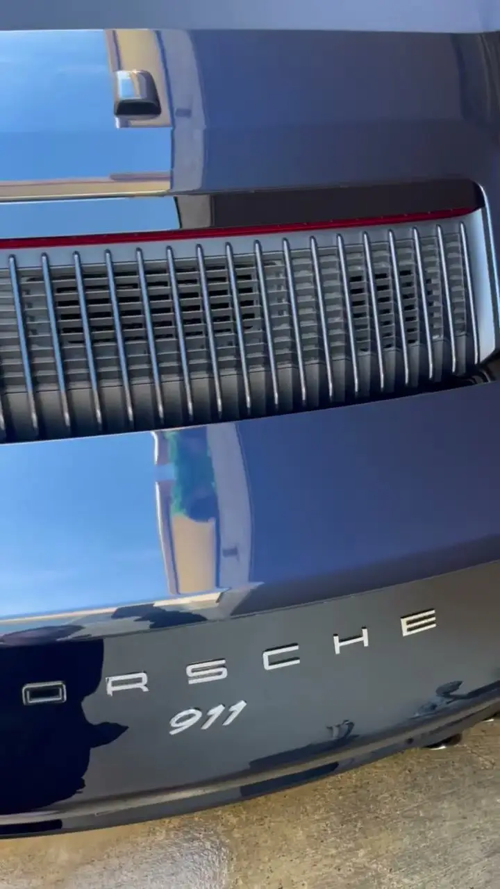 Porsche 911 engine-lid badge and grille, clean and glossy