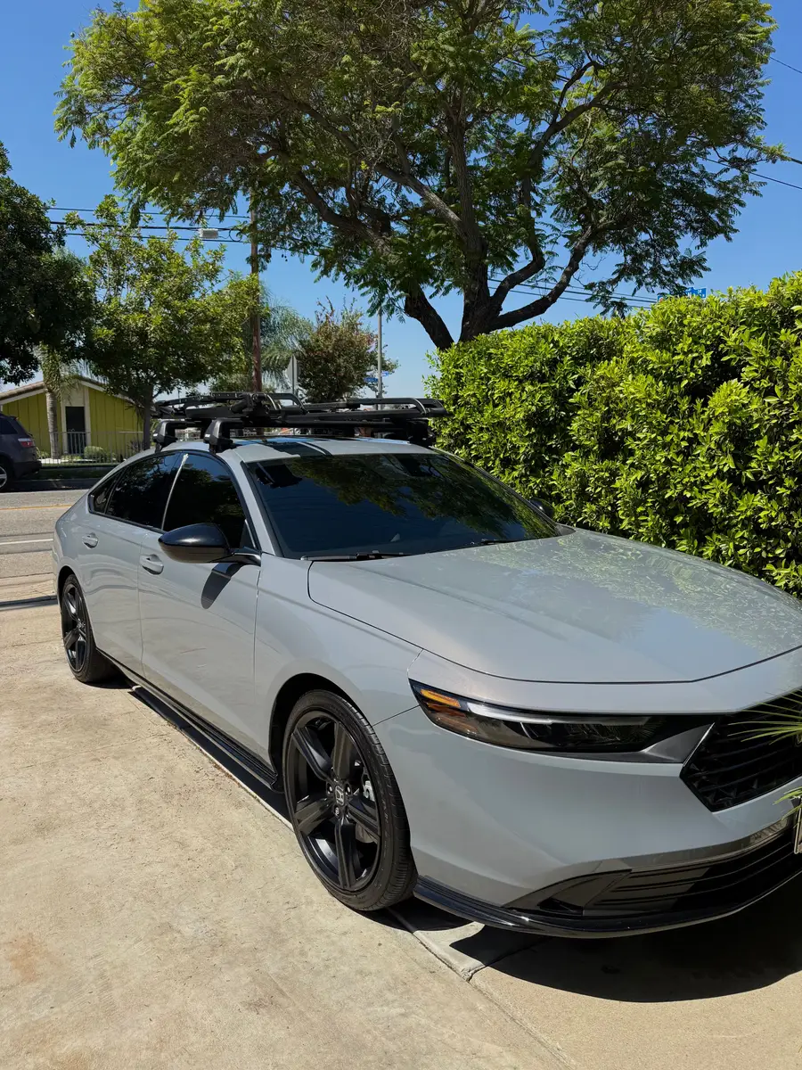 Grey Honda Accord with a roof rack after detailing, in a driveway