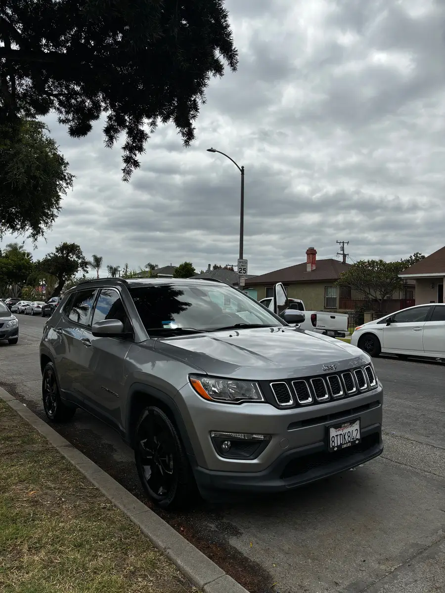 Grey Jeep Compass after detailing, parked at the curb