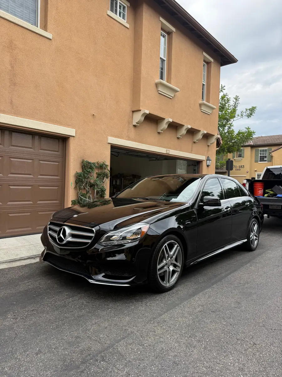 Black Mercedes-Benz E-Class with glossy paint after a detail