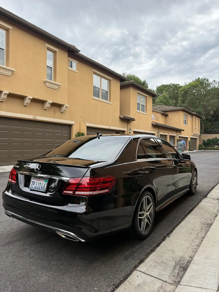Rear of a black Mercedes-Benz E-Class after an exterior detail
