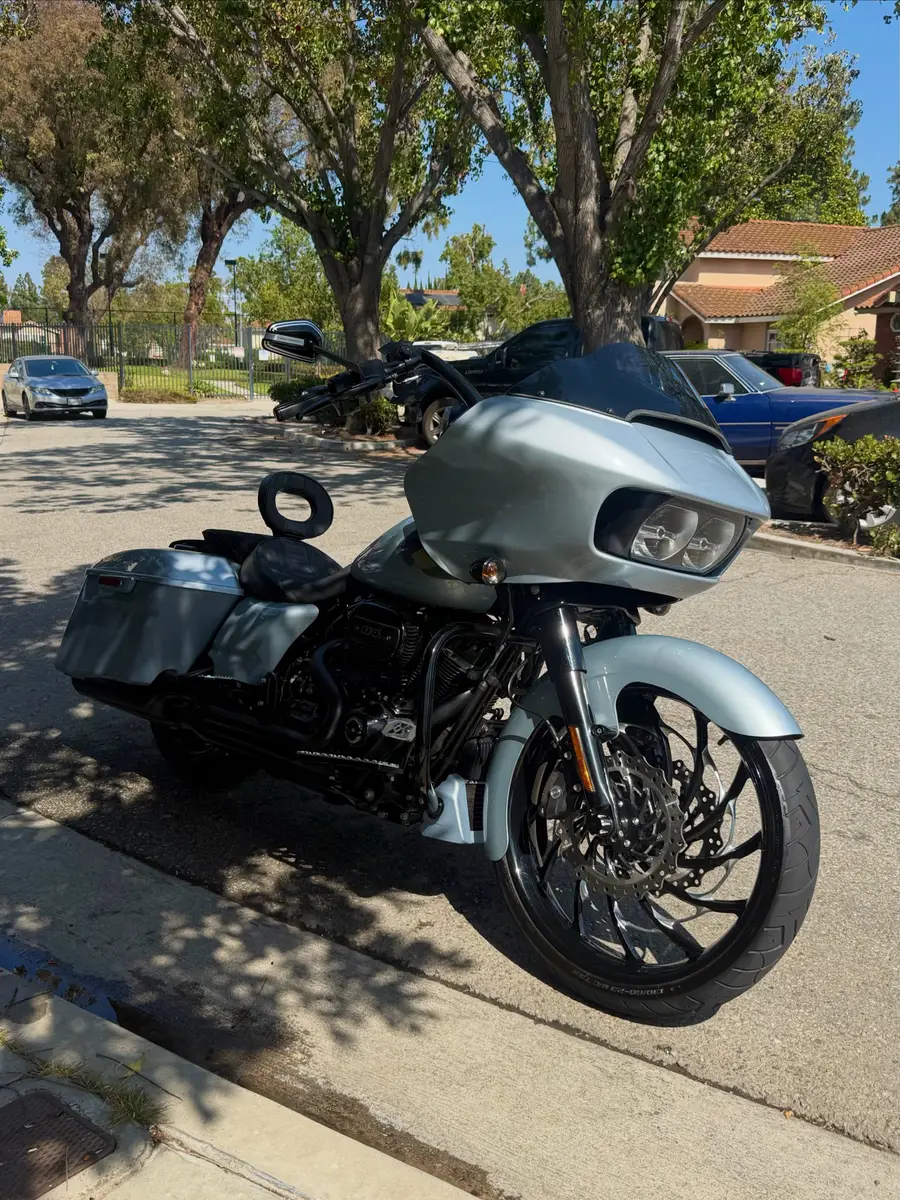 Silver Harley-Davidson motorcycle after detailing, parked on a driveway