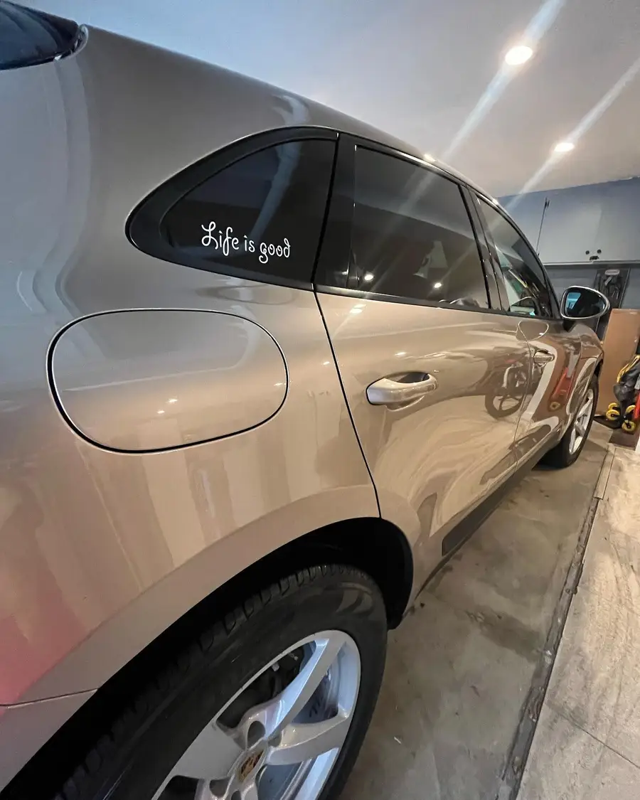 Side of a Porsche Macan after a maintenance wash