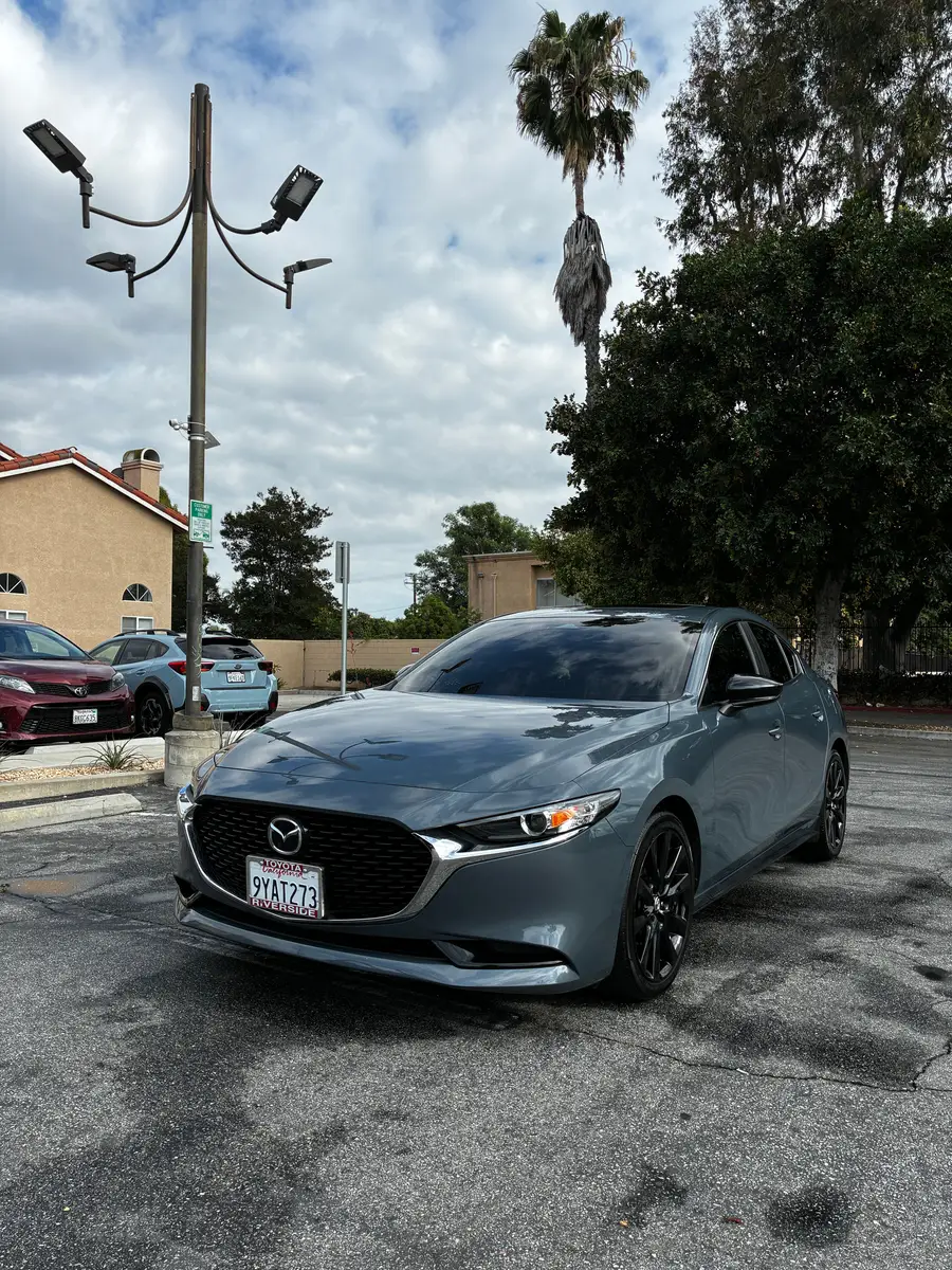 Grey Mazda3 after detailing, parked in a lot