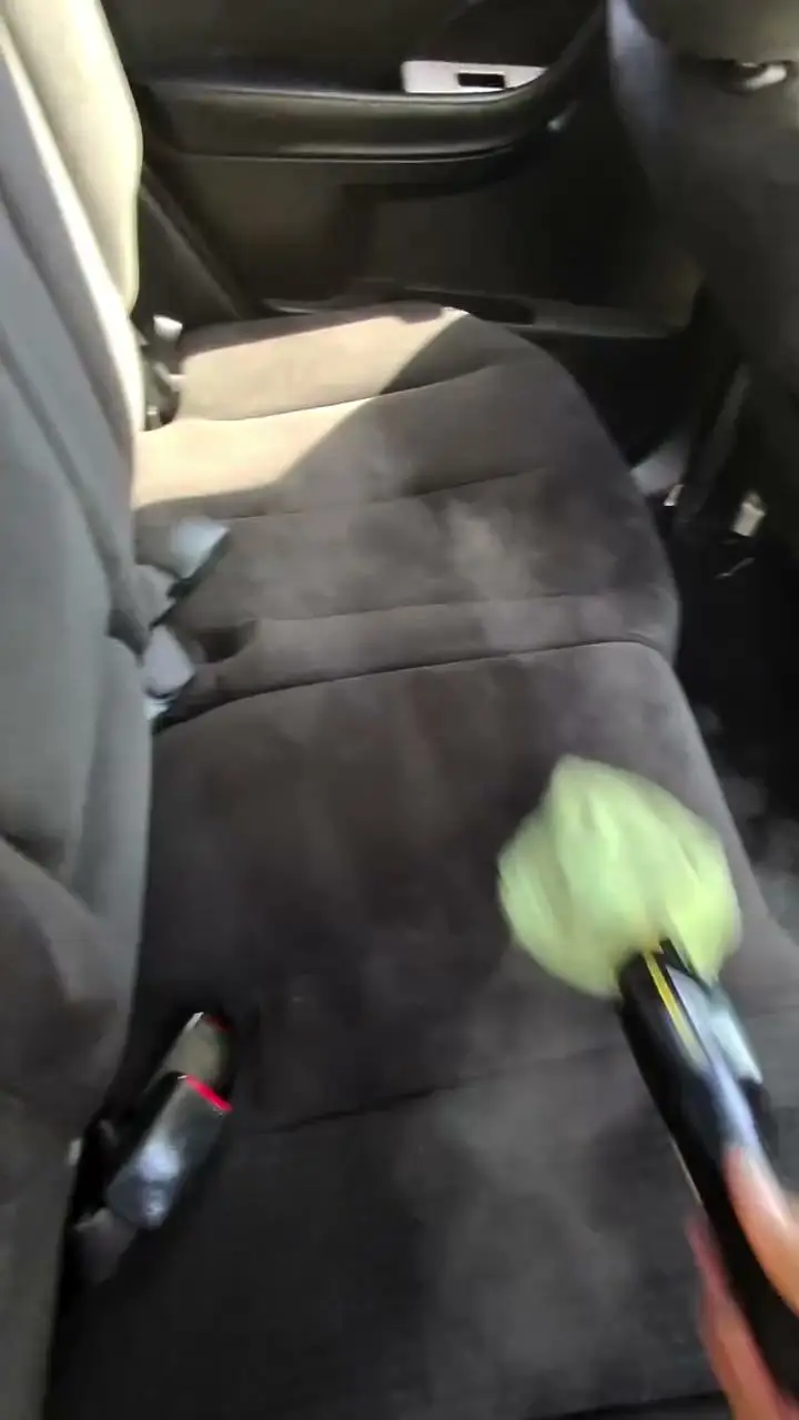 Brushing a cloth seat during an interior detail
