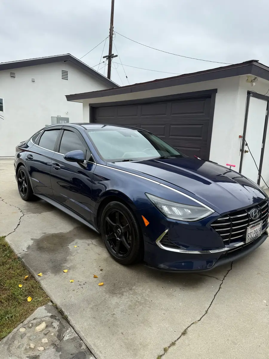 Navy Hyundai Sonata after a detail in a Bellflower driveway, Jun 2025