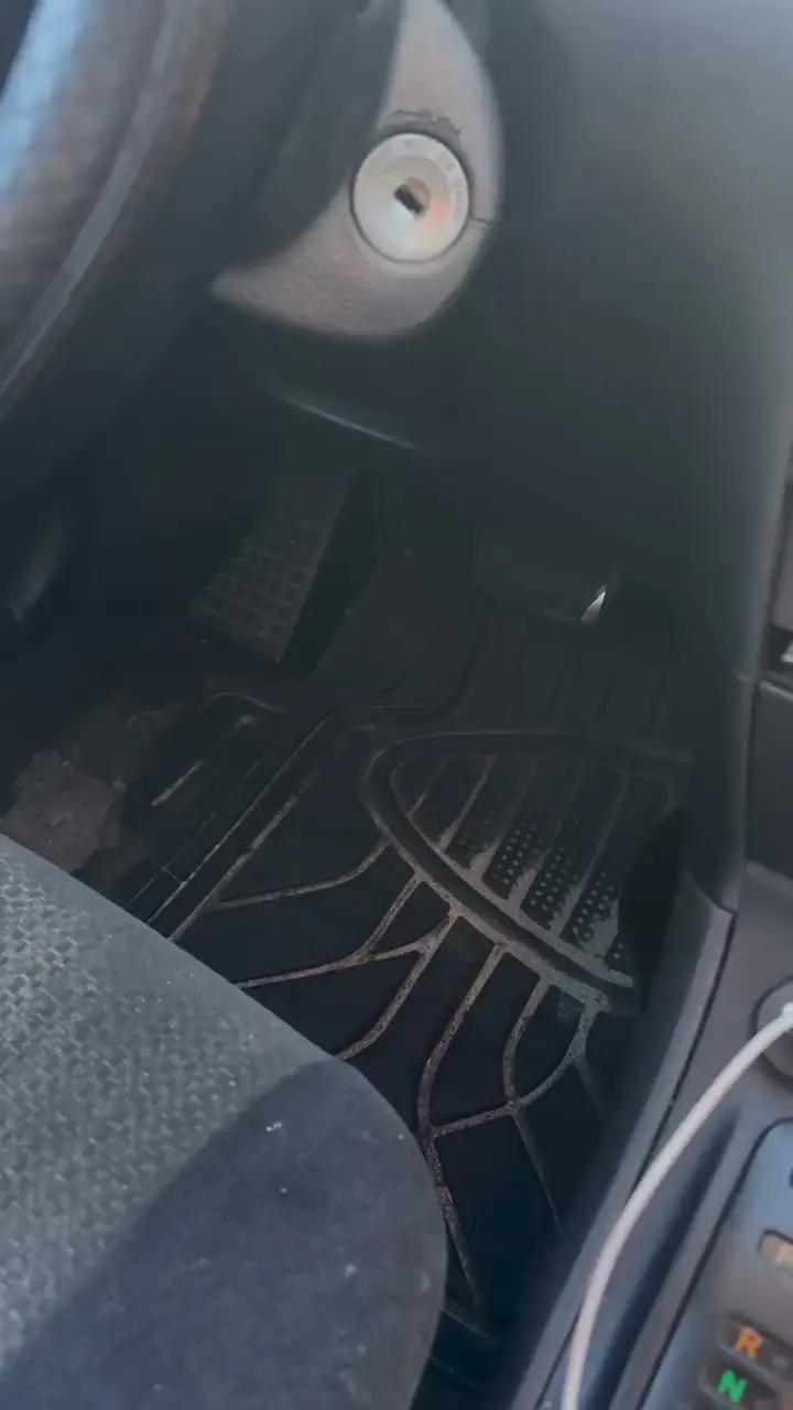 Dirty rubber floor mats and carpet before an interior detail