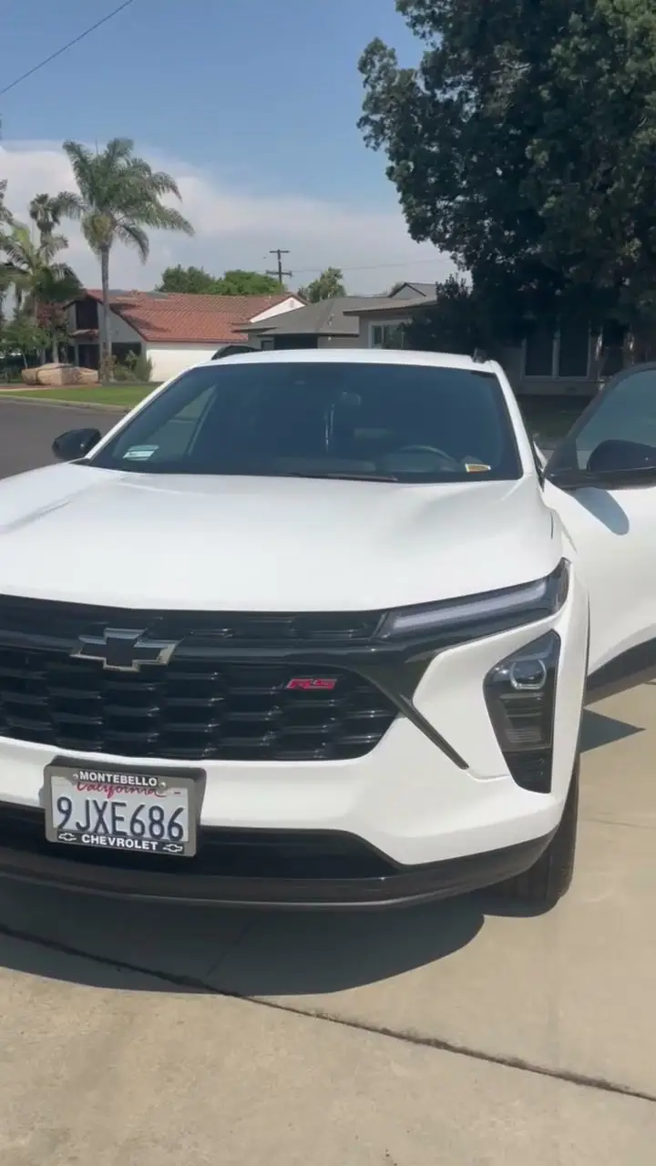 White Chevrolet Trax after detailing, in a driveway