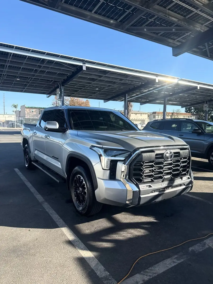 Silver Toyota Tundra from the front after a wash, under a solar carport