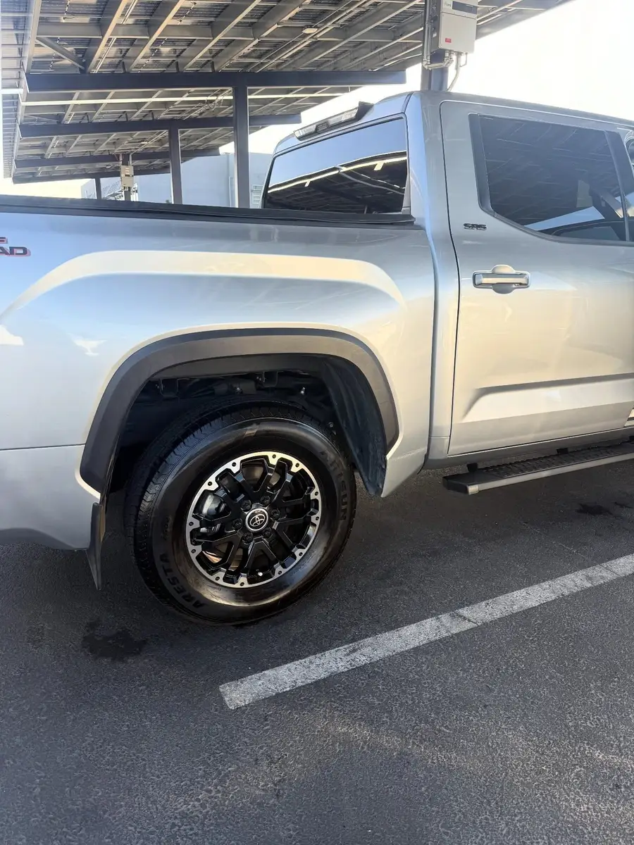 Cleaned wheel and dressed tire on a silver Toyota Tundra