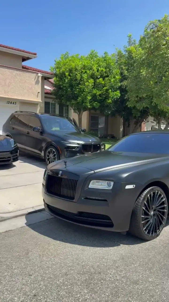 Matte black Rolls-Royce Wraith in a driveway after detailing